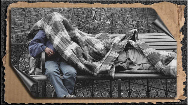 HOMELESS RESTING ON A PARK BENCH